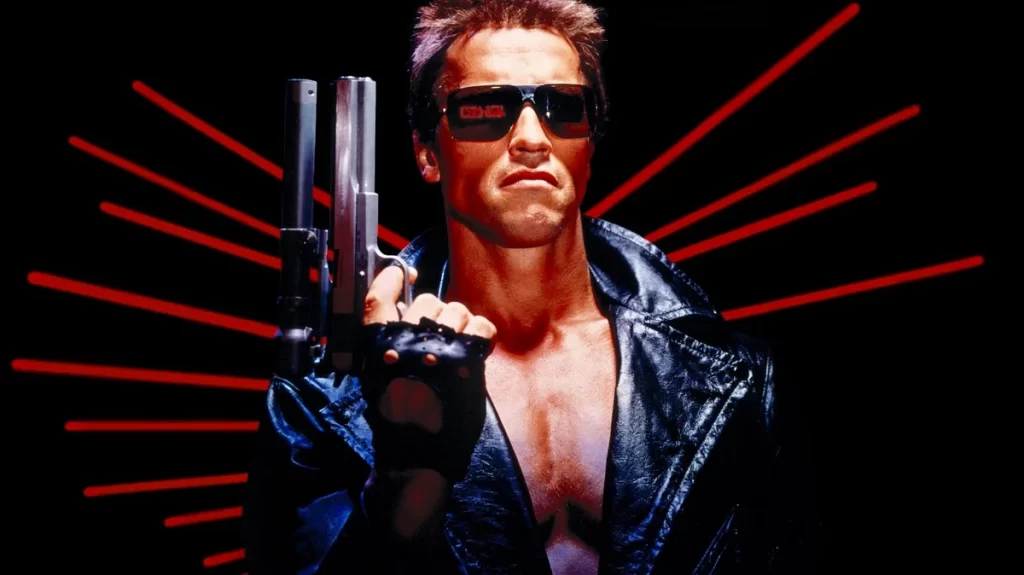 Man in leather jacket with sunglasses and shotgun.