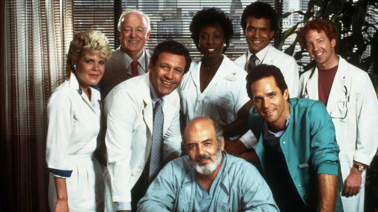 Cast of "Trapper John, M.D." posing together in a hospital setting.